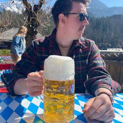 Tristan having a beer by the lake