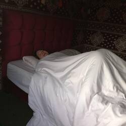Our bed in the tent. The walls are woven blankets.