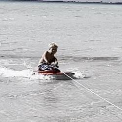 Being towed behind the car