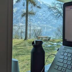 Doing work with a view of Traunsee Lake and mountains