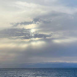 Crepuscular rays add to our enjoyment at dinner — Aboard Insignia.