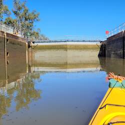 Inside the lock chamber about halfway down to the lower river level.