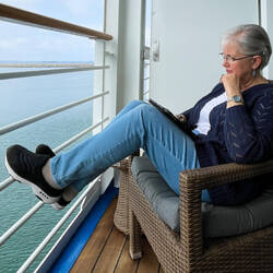 Reading on the veranda as we wait for the ship to be cleared — Ashdod Port, Israel.