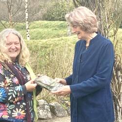 Jennie Beale , founder of Brigits Garden , presented with Ronnie's latest book