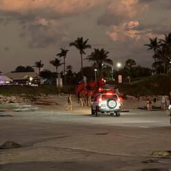 Vehicles join the camel train off the beach