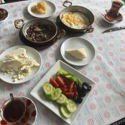 Turkish breakfast - cheese, beef, fried egg, honey and lavash