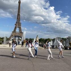 Dancers in front of eiffel tower