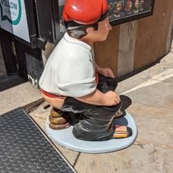 This is the Caganer - a Catalunyan Christmas tradition. Just...google it.