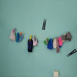 Hanging on the wall at the laundromat today . . . the sock graveyard.