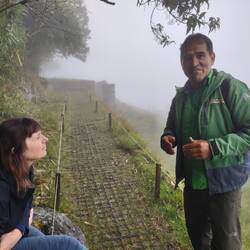 Santiago telling stories as we waited for the clouds to lift