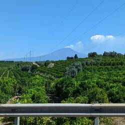 Etna erupting in the distance