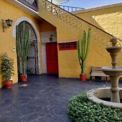 Our hostel! So pretty. That's our room through the red door...