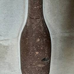 This is a real bottle within the concrete