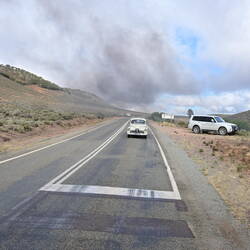 Old car, probably carrying a train nut