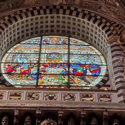 A stained glass window in the Siena Cathedral