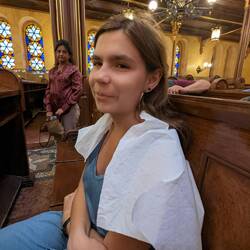 Anya had to cover her bare shoulders with a large paper provided at the entrance.