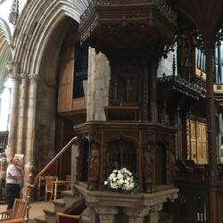 The pulpit, next to the wooden screen at the front of the nave