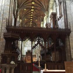Carved wooden screen separating the nave from the chancel
