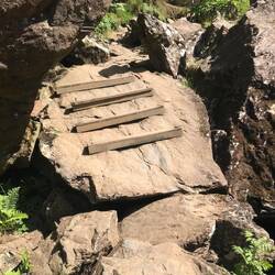 Steps bolted onto a huge rock