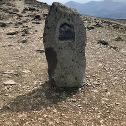Directional stone atop the PYG/ Miners track