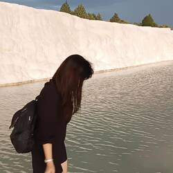 Feet dipping the thermal spring
