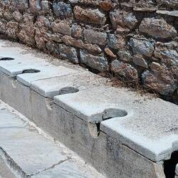 Ancient days loo for the rich & influential. Slaves warm by sitting bfr the masters sit.