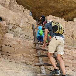 Climbing up into the ruins of the Long House.