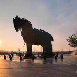 Sun setting behind the Trojan horse
