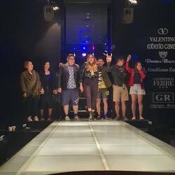 Sporting peeps from the tour group modelling on stage.