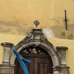 The badge above the door was proof of fire insurance back in medieval times