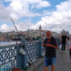 Men fishing along Galata Bridge in Istanbul.