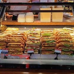 Display of sandwiches at a kiosk in d airport.