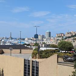 The Lantern of Genoa (lighthouse) can be seen on the left in the deep background.