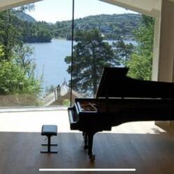The Recital Hall at Grieg's Home at Troldhaugen. The roof of his studio can be seen in the window.