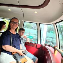 Riding on the top of the double decker.