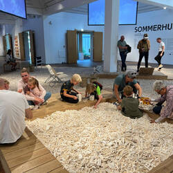 Children play with a mountain of Lego blocks
