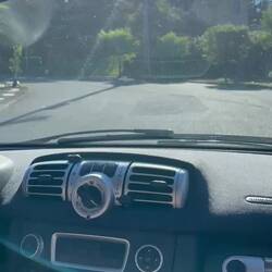 John driving the Smart (clown) car