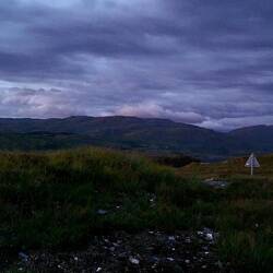 Darkness fell, bathing the landscape with blue light