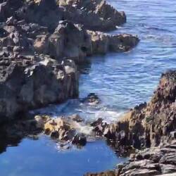Waves eventually reached the rock pool, bottom left