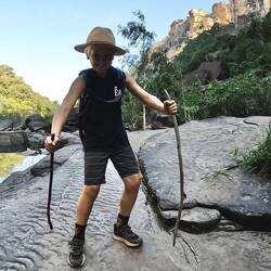 Lachie, skiing down some slippery rocks