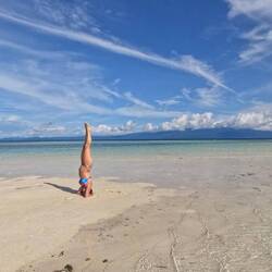 Headstand that the edge of the island