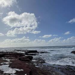 Watching the huge surf as the tide came in while we walked around the rocks.