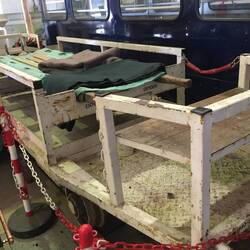 A stretcher for carrying the injured out along the underground rails.