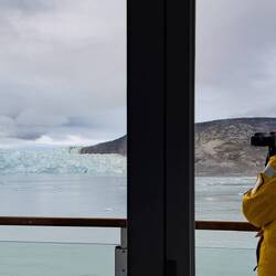 Mui shooting a last little bit of the scenery from the veranda — Eqip Sermia, Greenland.