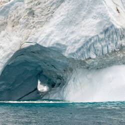 This ice cave has a window — Ilulissat, Greenland.