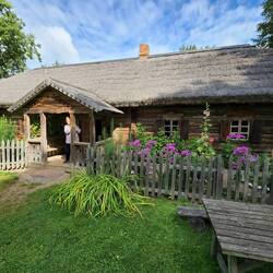 Marilyn on the porch of the Aukštaitija farmhouse