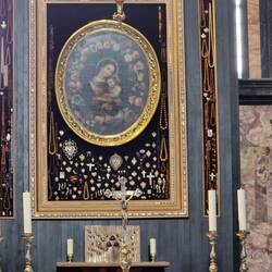 The Altar with votive offerings inside Inside Church of the Visitation
