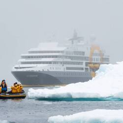 We deploy off on a zodiac cruise with Ultramarine shrouded by the fog — Baffin Bay, Greenland.