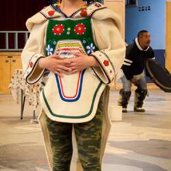 The long flap on the back ensures insulation when sitting — Pond Inlet, Baffin Island.