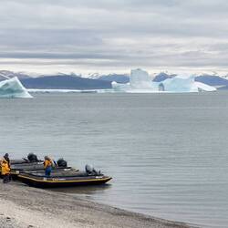 The zodiacs are waiting to take us for a closer look at the grounded bergs — Low Point on Baffin.